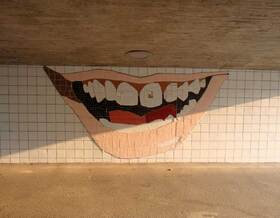  <p>... and a tiled representation of his smile in the tunnel underneath.</p>